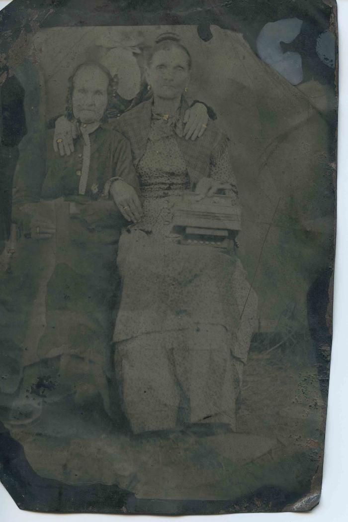 Two women, third person obscured
