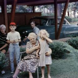 Exterior of family beside carport