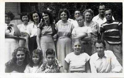 Group of men and women posing for a photograph