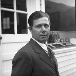 Man posing for a photo outdoors