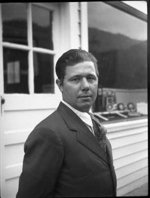 Man posing for a photograph outdoors
