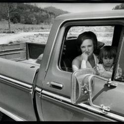 Woman and daughter in pickup truck