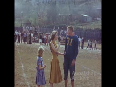 High school football game with cheerleaders (silent)