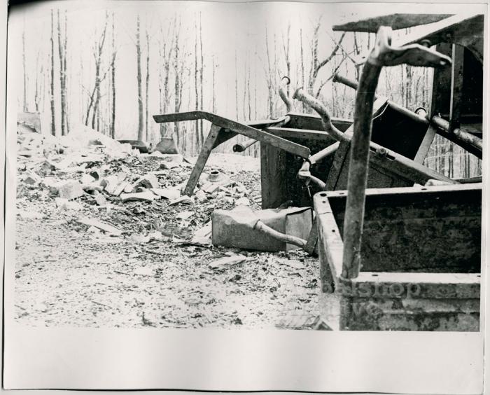 Production still of a pile of school desks, exterior - The Struggle of Coon Branch Mountain