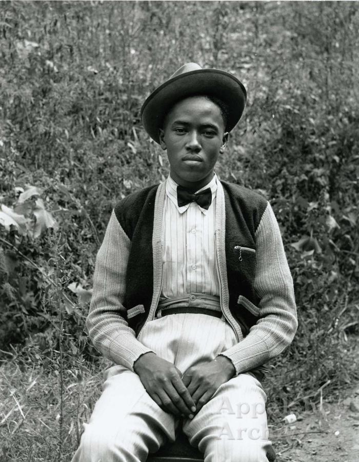 Exterior portrait of young man in hat