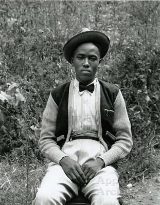Exterior portrait of young man in hat