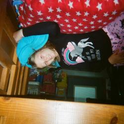 Girl in pajamas on bunk bed