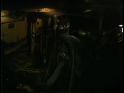 Footage inside coal mine, continuous miner