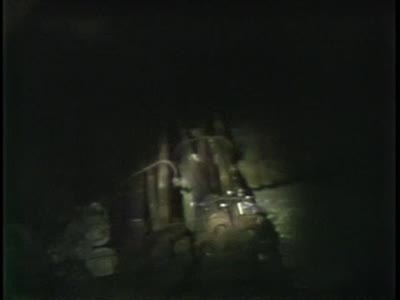 Footage inside coal mine, discussion of city people, dangers of mining