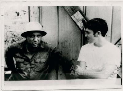 Coal miner and young man in conversation (In Ya Blood)