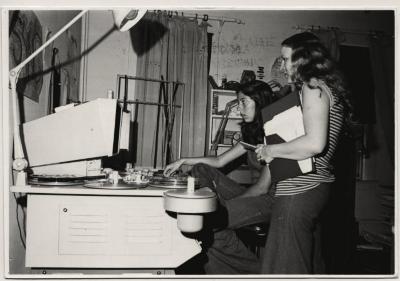 Production still of two women (Elizabeth Barret and Diana Ott) editing film - Kingdom Come School